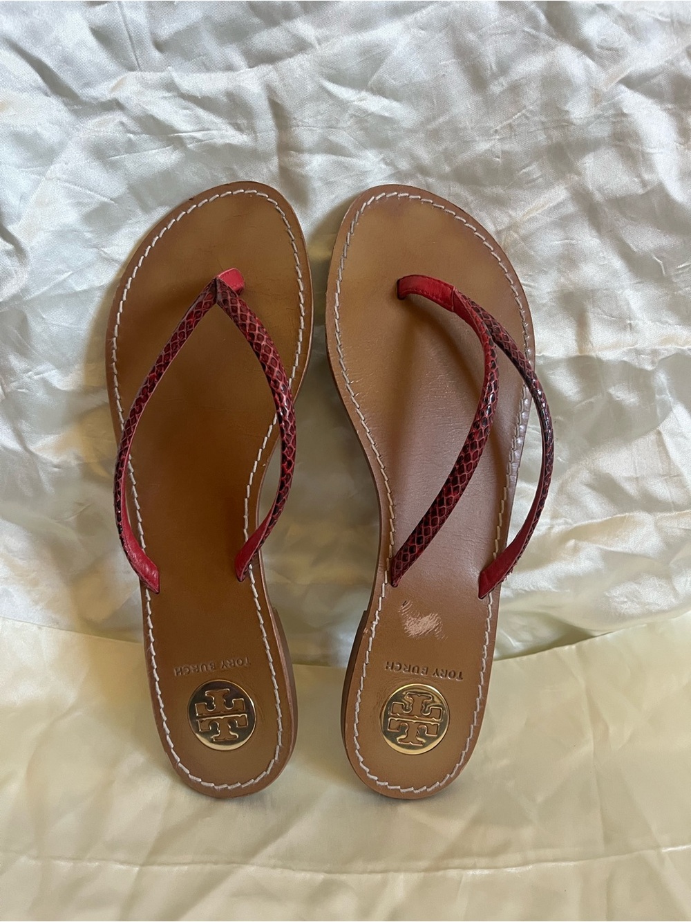 Tory Burch red flip flops. Size 8.5. Flaw